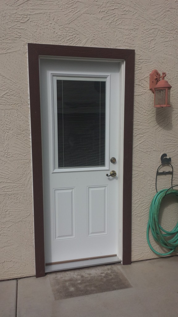 Two panel metal door with Mini Blinds