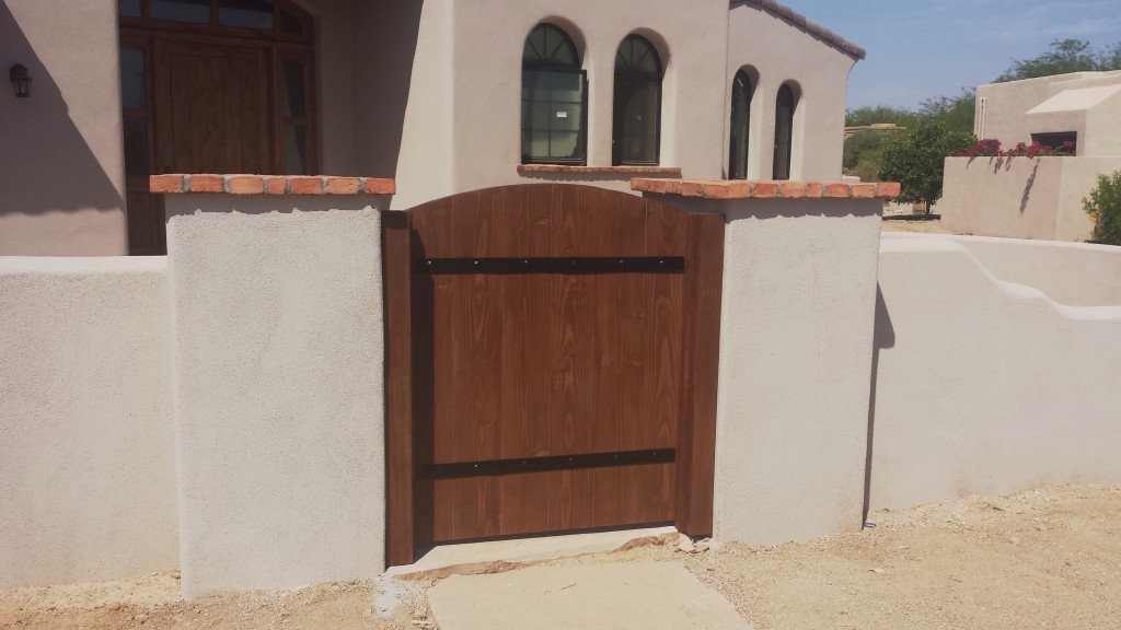 Custom wooden gate with metal straps and clavos