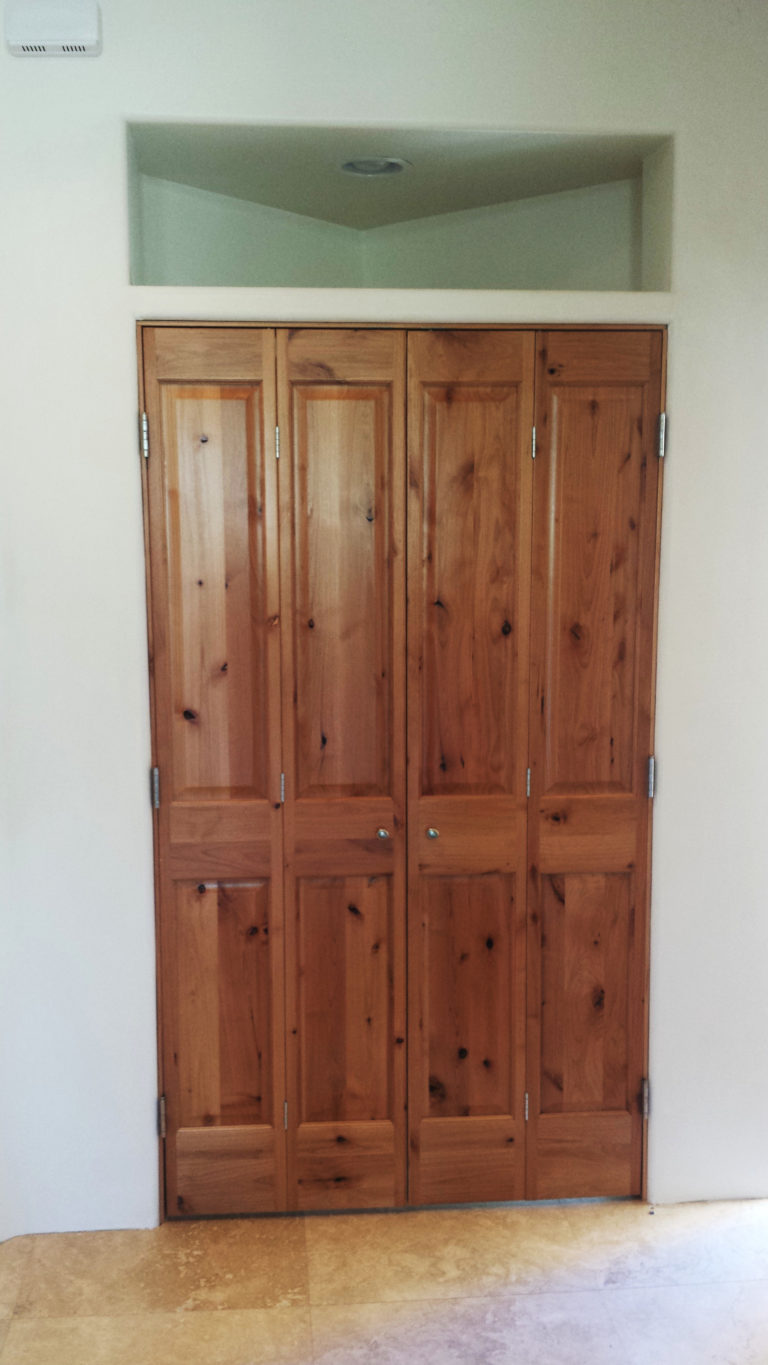 Custom Design Bi Fold Knotty Alder Doors