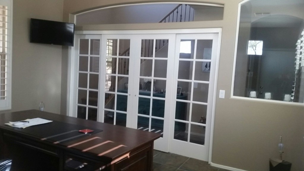 Four French doors installed in an archway