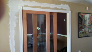 Sliding French door with one fixed panel, showing the drywall work.
