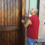 Replacing a four by eight feet door with a new one.