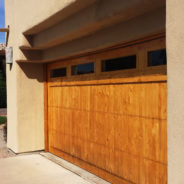 Refinishing wooden garage door.